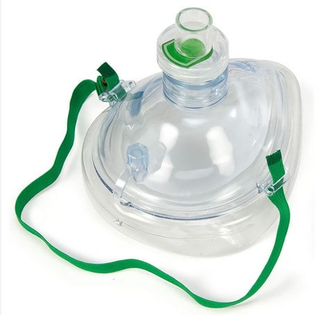 Clear plastic first aid mask for sports emergency kits with green strap and adjustable valve.