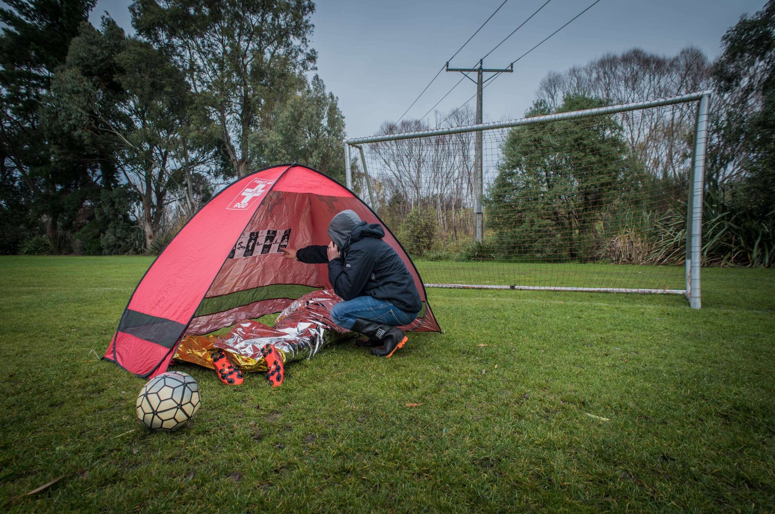 First aid kit for sports injury response at soccer field, essential for first aid kits for sport teams.