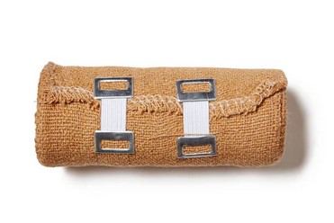 First aid kit for sports injury with bandage roll for emergency treatment.